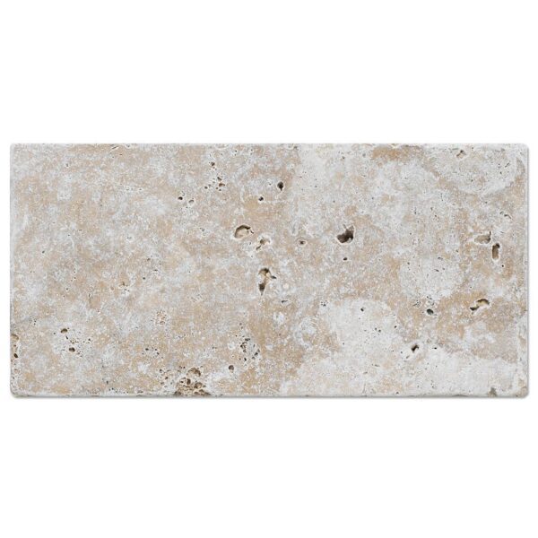 A White Travertine 6×12 Paver with a beige and white pattern.