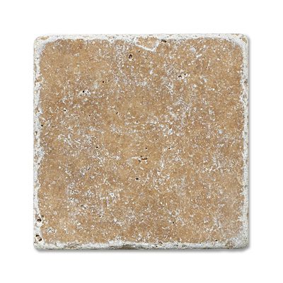 A Noce Travertine Tumbled tile on a white background.