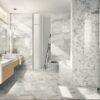 A bathroom with marble walls and floors.