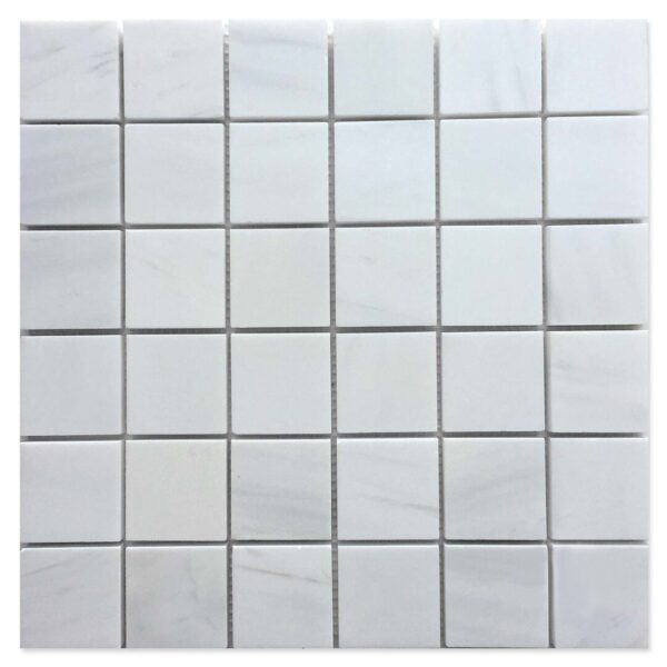 A white tile floor with some squares on it