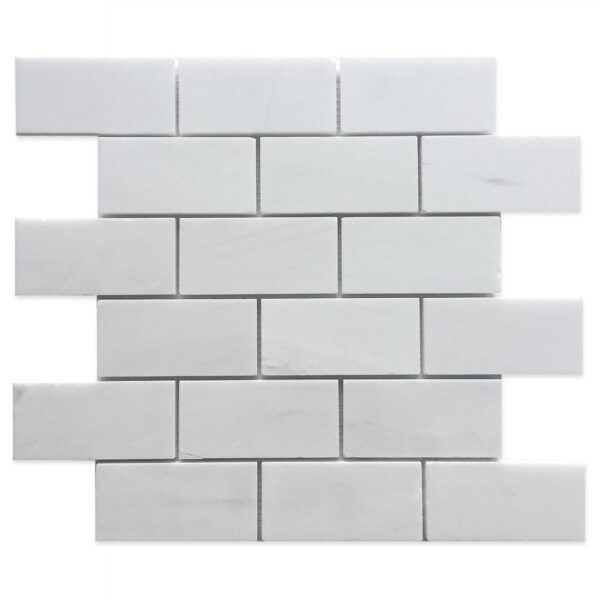 A white brick wall with some small bricks