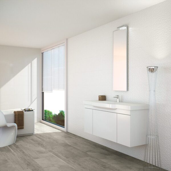 A bathroom with white walls and wooden floors.