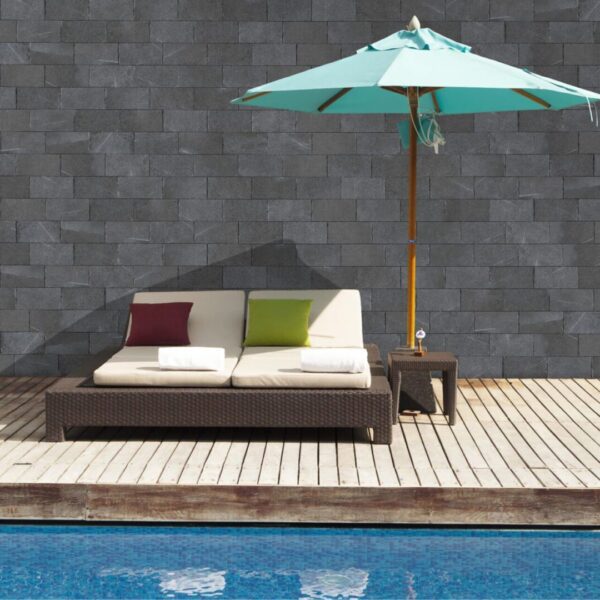 A pool with an umbrella and a chair
